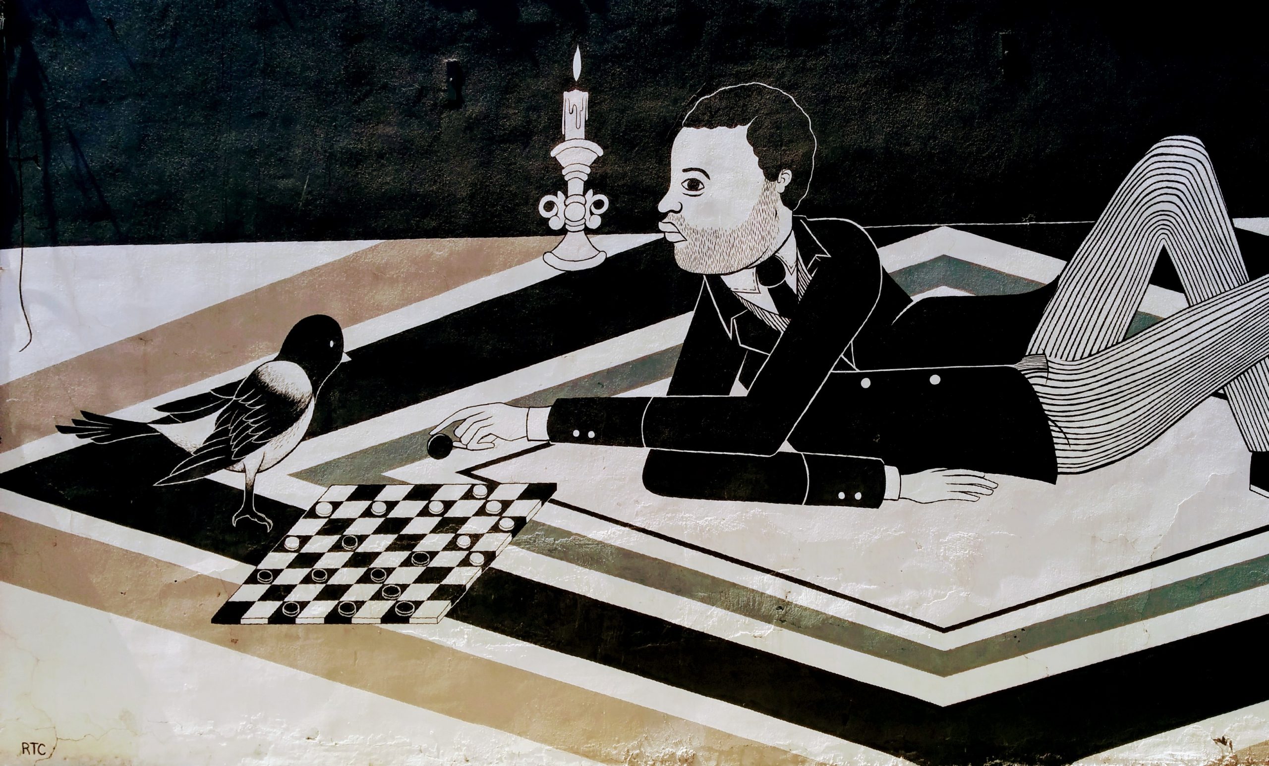 Mural of a man playing checkers with a bird.