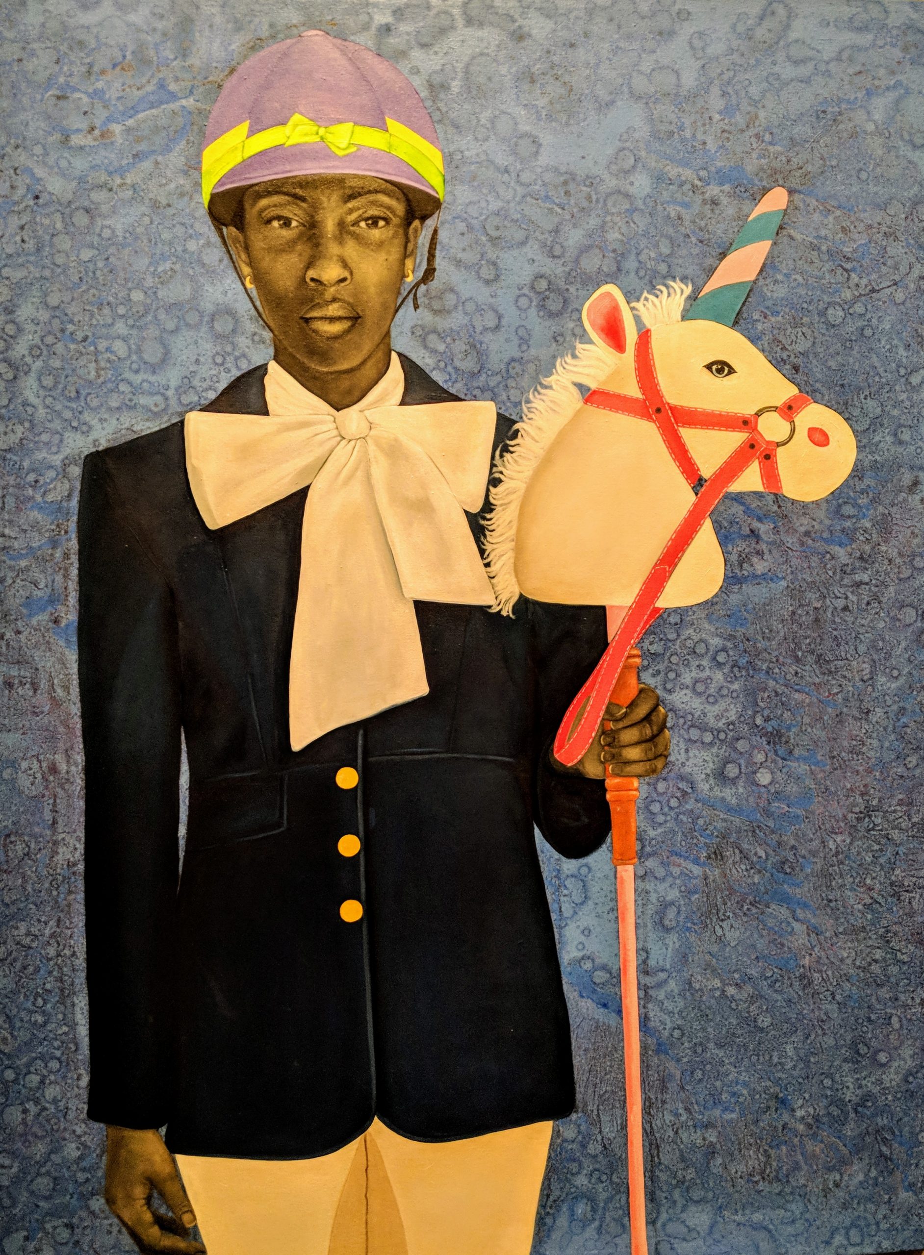 Painting of a woman in horse riding clothes holding a toy of a unicorn head on a stick.