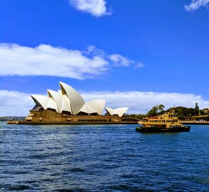 Boat passing in front of the Sydney Opera House.