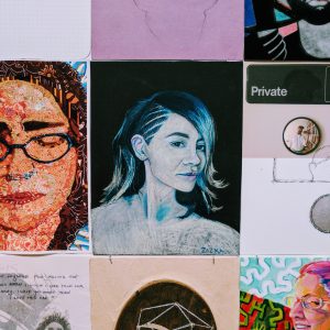 A 3x3 grid of self portrait drawings with a drawing of a young women in the center.
